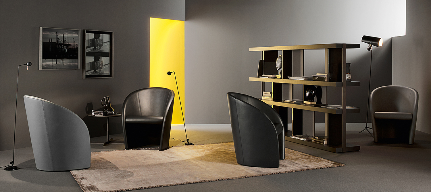 Butaca Intervista de Poltrona Frau en Pelle Frau®, estructura de acero y poliuretano, diseño italiano de Vignelli, confort envolvente